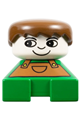 Duplo figure brick with green base and brown overalls, brown hair, and white head - 2327pb17