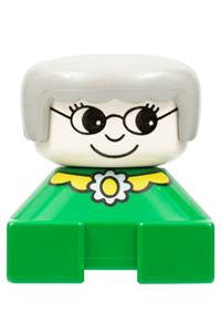 Duplo Grandmother - Grandmother Duplo figure with gray hair and white head, on a green base with yellow collar and flower - 2327pb23