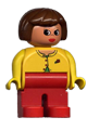 Female Duplo figure with red legs, wearing a yellow blouse with red buttons, and brown hair - 4555pb022