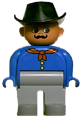 Male Duplo figure with light gray legs, wearing a blue top with a red bandana and a black cowboy hat - 4555pb088