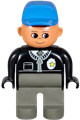 Male Duplo police figure with dark gray legs, wearing a black top with zipper, tie, badge, and blue cap - 4555pb090