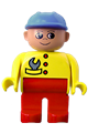 Male Duplo figure with red legs, wearing a yellow top with a wrench in pocket and a blue construction hat - 4555pb106