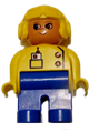 Female Duplo figure with blue legs, yellow top with pocket radio, wearing a yellow aviator helmet and eyelashes - 4555pb107