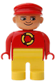 Male Duplo figure with yellow legs, wearing a red top with a recycle logo and a red cap with a turned-down nose - 4555pb125