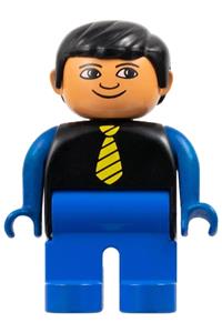 Duplo Male - Male Duplo figure with black hair, blue legs, black top with yellow tie, blue arms, and white in eyes pattern - 4555pb131