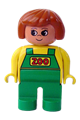 Female Duplo figure in a yellow top with green overalls, dark orange hair, and green legs - 4555pb133
