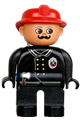 Male Duplo fireman with black legs wearing a black top with flame logo, red fire helmet, and a moustache - 4555pb151