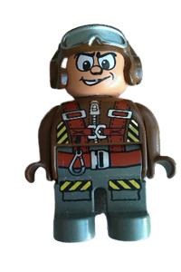 Duplo Male Action Wheeler - Male Duplo figure in brown top with parachute straps, dark gray legs, and a brown helmet with goggles - 4555pb153