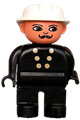 Male Duplo fireman with black legs and top featuring 6 yellow buttons, wearing a white fire helmet and moustache - 4555pb156