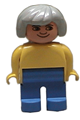 Female Duplo figure with gray hair, wearing yellow blouse and blue legs - 4555pb158