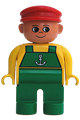 Male Duplo figure wearing green legs, yellow top with green overalls and anchor, and a red cap - 4555pb168