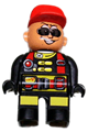 Male Duplo figure in Action Wheeler outfit with black legs, yellow patches, red straps, sunglasses, and a red cap - 4555pb182