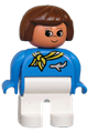 Female Duplo figure with white legs, wearing a blue top with a scarf and jet airplane, and brown hair with turned up nose - 4555pb218