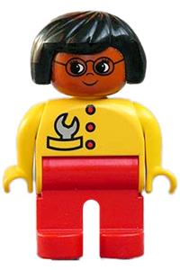 Duplo Female - Female Duplo figure with red legs, yellow top with red buttons, black hair, glasses, carrying wrench, brown head - 4555pb247