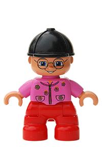 Duplo Figure Lego Ville, Child Girl, Red Legs, Dark Pink Top With Flowers, Black Riding Helmet, Glasses 47205pb005