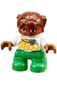 Duplo Child Girl - Lego Ville Duplo Figure of a child girl with green legs, wearing a white top with yellow pattern and a blue bow. She has brown hair, a brown head, and magenta glasses - 47205pb039