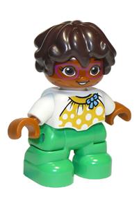 Duplo Child Girl - Lego Ville Duplo figure of a child girl with bright green legs, a white top with yellow pattern and blue bow, dark brown wavy hair, and magenta glasses - 47205pb076