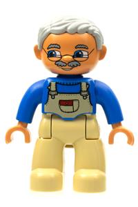 Duplo Male - Male Duplo Figure from Lego Ville with tan legs, wearing a blue top with tan overalls bib, glasses, and light bluish gray hair - 47394pb011b