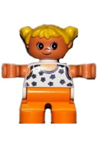 Duplo Child Girl - Duplo figure of a girl with orange legs, wearing a white blouse with blue flowers, and yellow hair in pigtails - 6453pb034