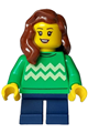 Girl child with reddish brown hair over shoulder wearing a bright green sweater with bright light yellow zigzag lines and dark blue short legs - adp110