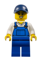 Female train worker wearing blue overalls and a dark blue cap - adp121