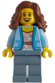 Female passenger with bright light blue jacket over white shirt with coral flowers, sand blue legs, and reddish brown wavy hair - adp135