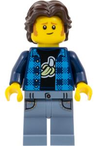 The Art of Chocolate Customer - Male customer wearing a dark azure flannel shirt over a dark blue banana T-shirt, sand blue legs, and dark brown short wavy hair - adp162