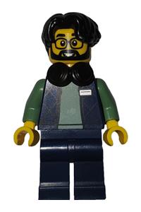 Art Factory Photographer Minifigure - Male Art Factory photographer with black hair parted on right, wearing headphones around neck, dark blue bodywarmer over sand green sweater, and dark blue legs - bdp274