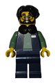 Male Art Factory photographer with black hair parted on right, wearing headphones around neck, dark blue bodywarmer over sand green sweater, and dark blue legs - bdp274