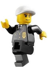 Police Minifigure - Police officer in city suit with blue tie and badge, black legs, white short bill cap, and scowl - cty0255