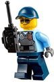 City police officer with sunglasses wearing a gray vest with a radio and gold badge, dark blue legs, and a cap - cty0619