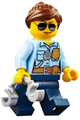 Female city police officer with bright light blue shirt, badge, radio, reddish brown ponytail and swept sideways fringe, and dark blue legs - cty0744