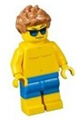 A male beachgoer wearing blue swim trunks and sunglasses - cty0760
