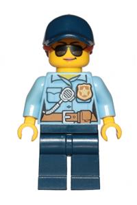 Police Officer Minifigure - Female city police officer in a bright light blue shirt with badge and radio, dark blue legs, cap with dark orange ponytail, and sunglasses - cty1090