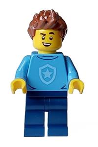 City Officer in Training Male - Male police officer in training with medium blue shirt and badge, dark blue legs, reddish brown hair, and open smile - cty1561