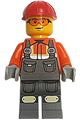 Male construction worker in dark bluish gray overalls over reddish orange safety jacket with reflective stripes, dark bluish gray legs, red construction helmet, safety glasses - cty1862