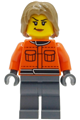 Female Formula 1 pit crew member wearing a reddish orange racing suit with pockets, dark bluish gray legs, and dark tan tousled hair - cty2000