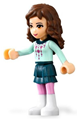 Olivia from Friends wearing a light aqua long sleeve Christmas top and a dark blue layered skirt - frnd030