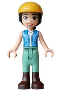 Friends Liann - Liann from Friends wears a dark azure and bright light blue vest over a white top, sand green trousers, dark brown boots, and a bright light orange horse riding helmet - frnd0872