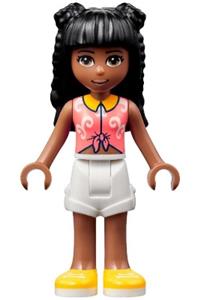 Friends Priyanka - Priyanka in white shorts and a coral knotted blouse with white swirls, completed with yellow shoes - frnd515