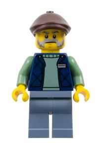 Corner Kiosk Vendor Minifigure - Male corner kiosk vendor wearing a dark blue bodywarmer over a sand green sweater, sand blue legs, and a dark brown flat cap - gen190