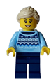 Female vendor at winter market stall wearing a bright light blue knit fair isle sweater, with dark blue legs and a tan ponytail - hol331