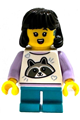 Girl child with black midlength hair, hearing aid, wearing a white top with raccoon and dark turquoise short legs - idea243