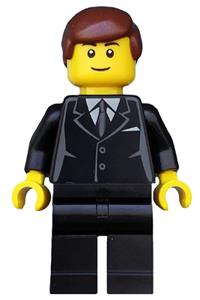 Male with Suit Minifigure - Male minifigure in a black suit with reddish brown hair, black eyebrows, and a thin grin - twn173