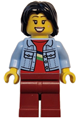Woman with black mid-length tousled hair, wearing bright light blue denim jacket and dark red legs - twn500